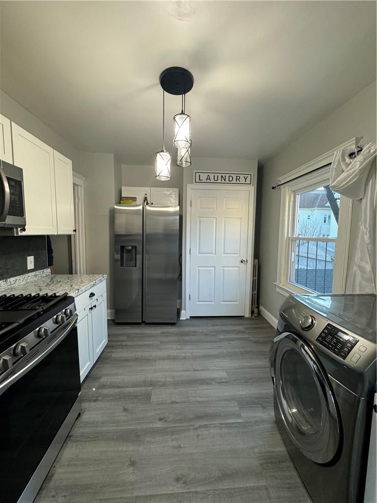 a kitchen with granite countertop a stove and a sink