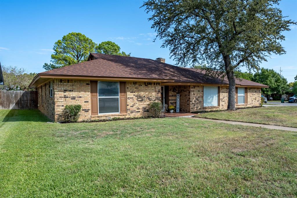 Ranch-style house featuring a front lawn