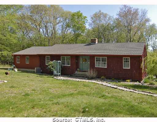 Exterior Front. A very pretty setting frames this expanded 2200 Square Foot Ranch which was totally gutted and remodeled in 2000.