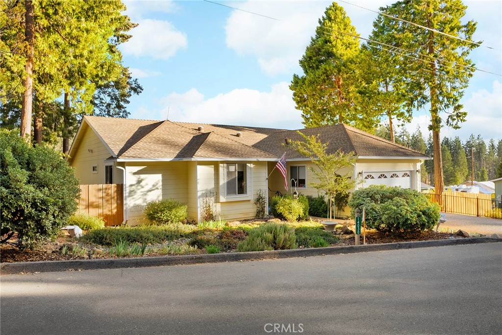 front view of a house with a garden