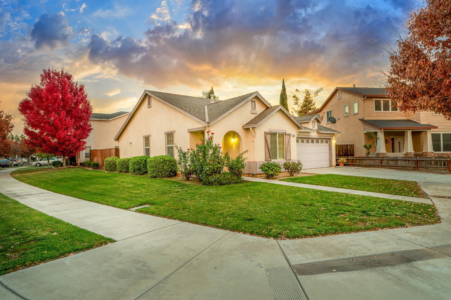 a front view of a house with a yard