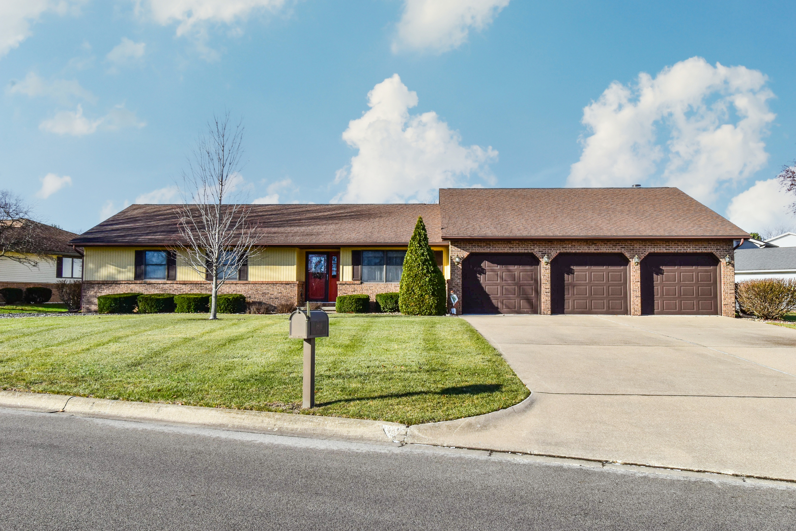 a front view of a house with a yard