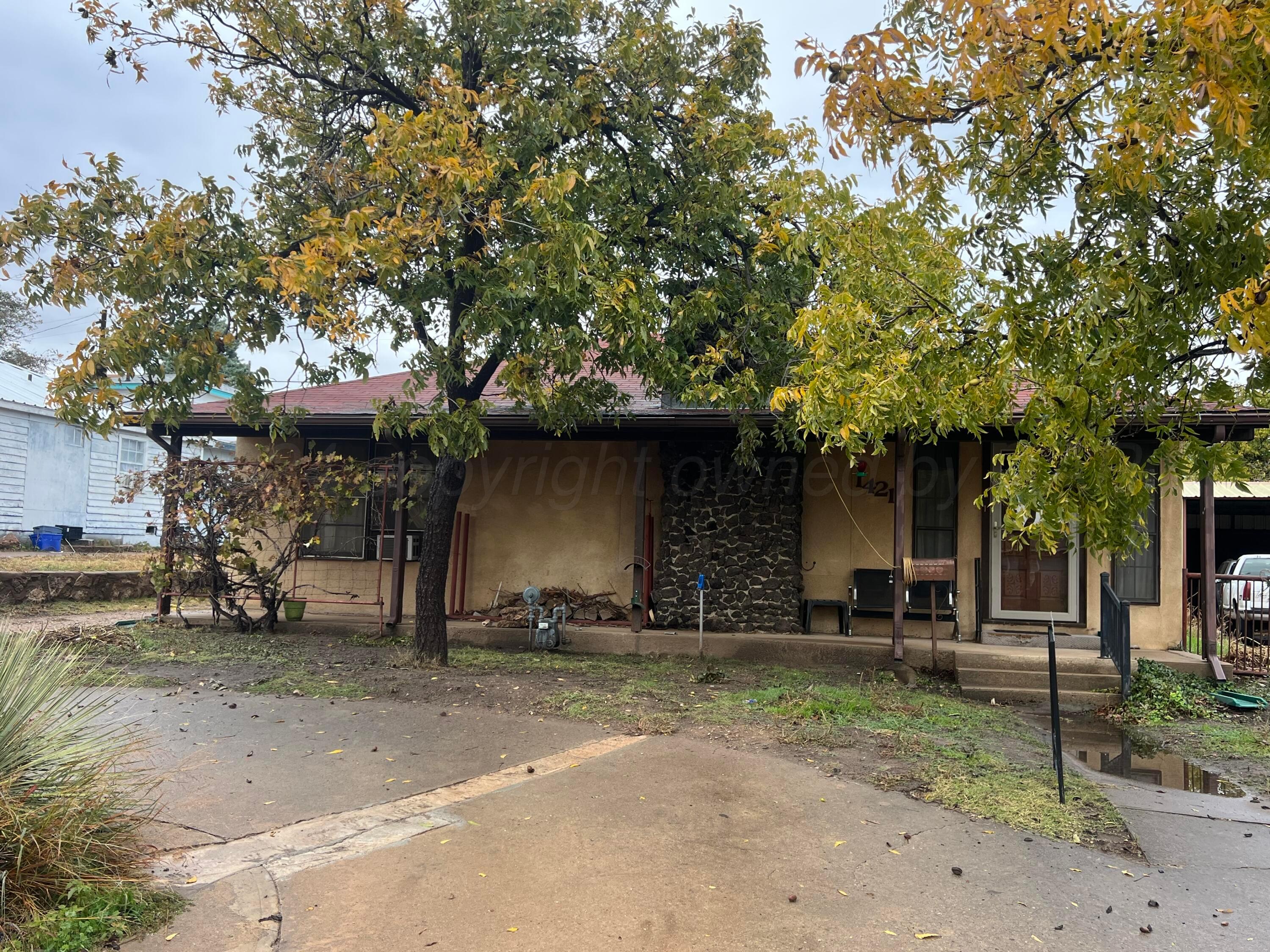 a view of a house with a tree