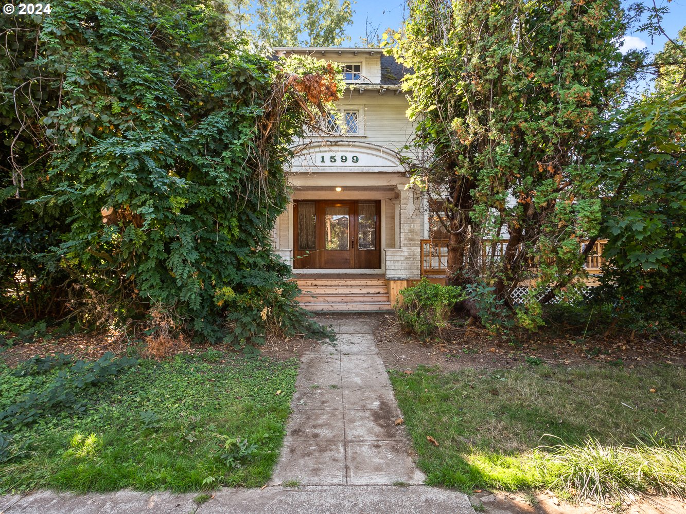 a front view of a house with garden