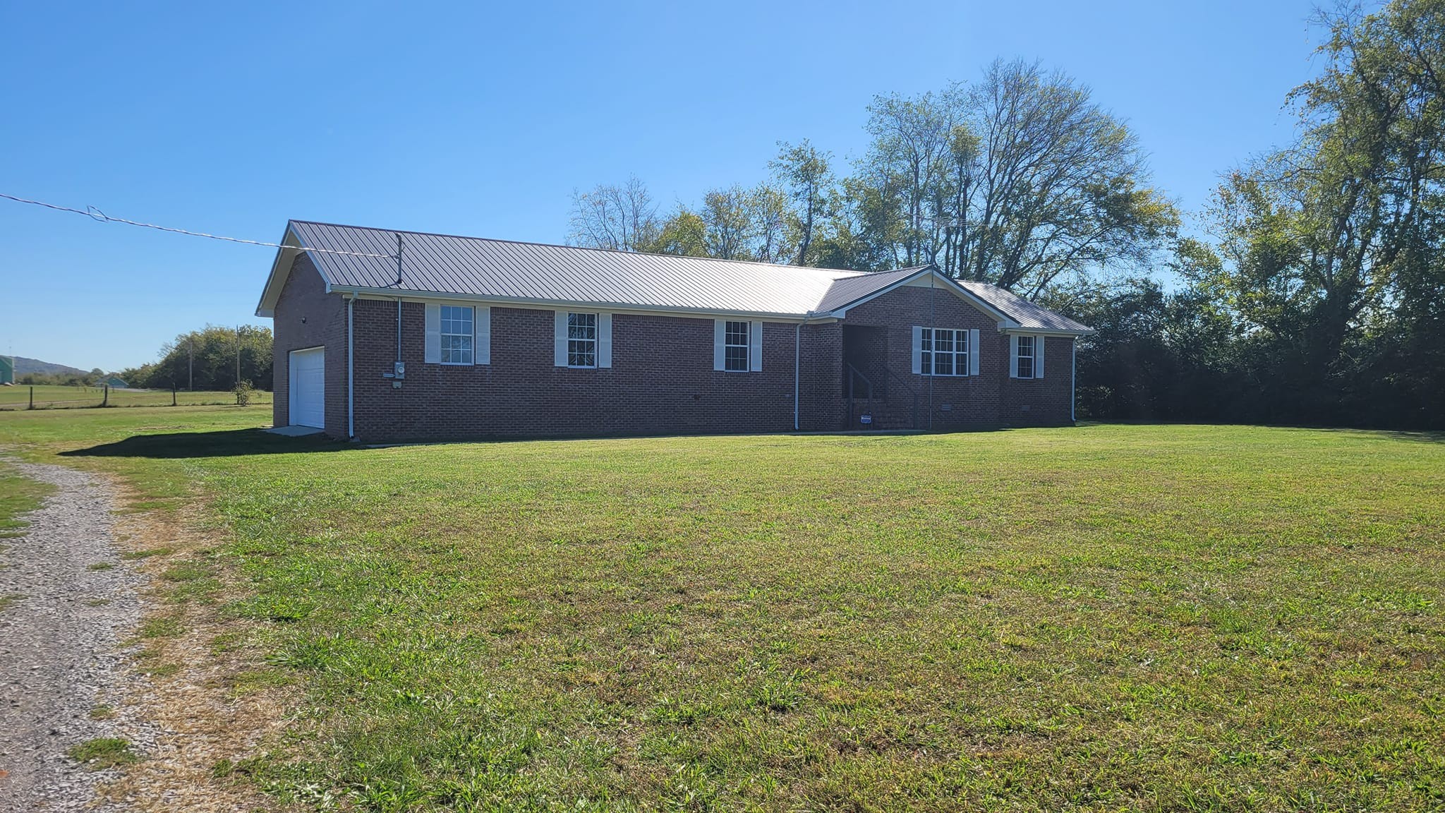 a view of a yard in front of a house with a yard