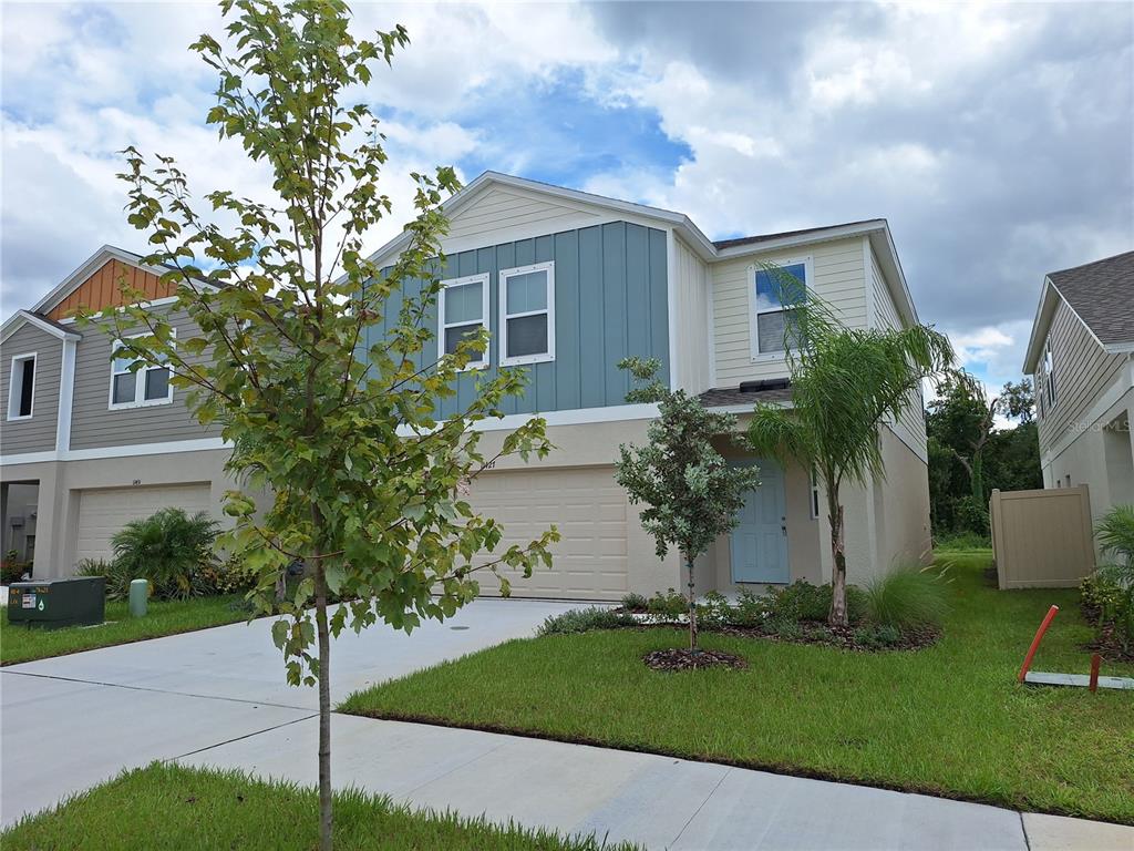 a front view of a house with garden