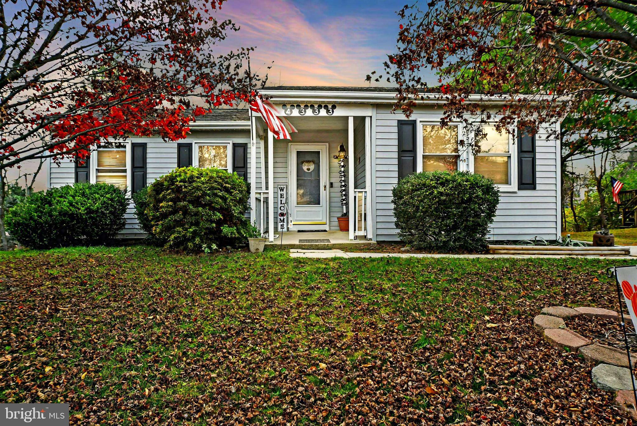 front view of a house with a garden