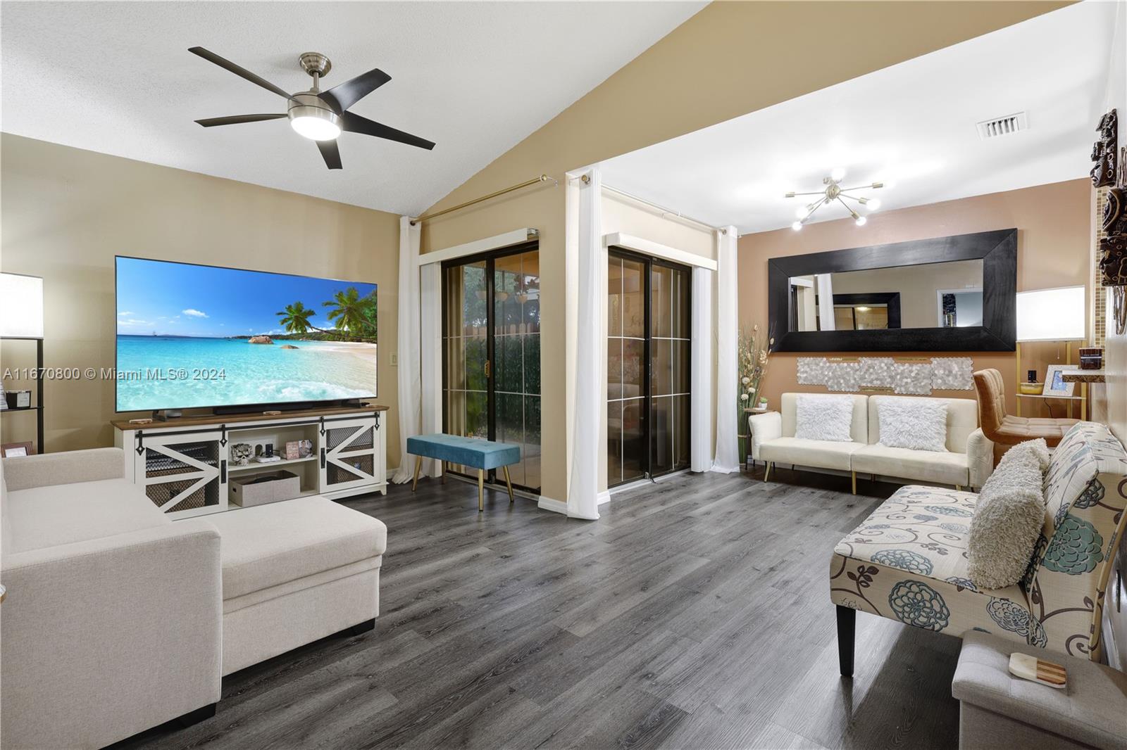 a living room with furniture and a flat screen tv