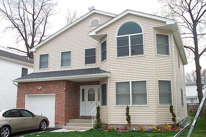 a front view of a house with a garage