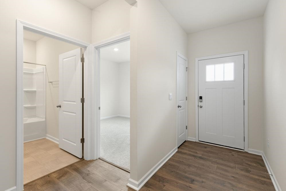 a view of entryway with wooden floor