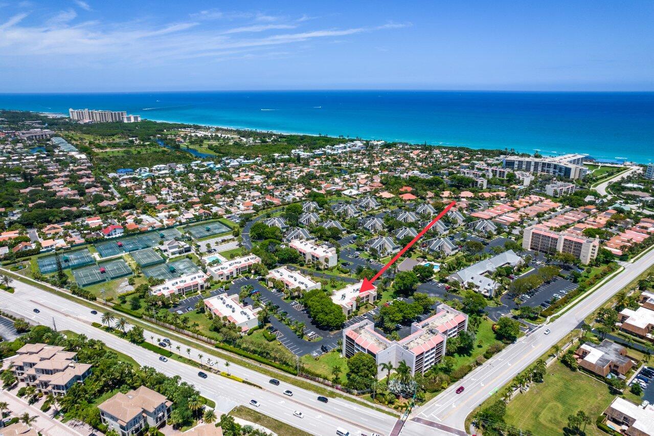 an aerial view of city and lake