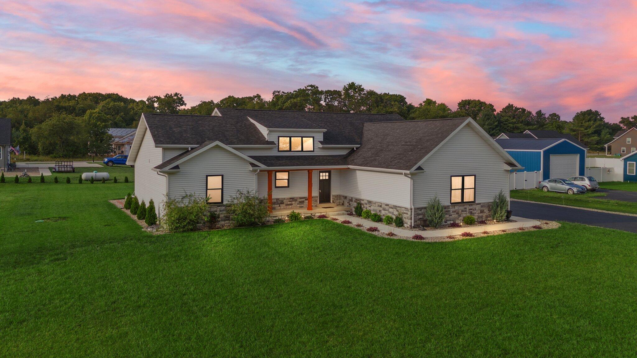 a front view of a house with a yard