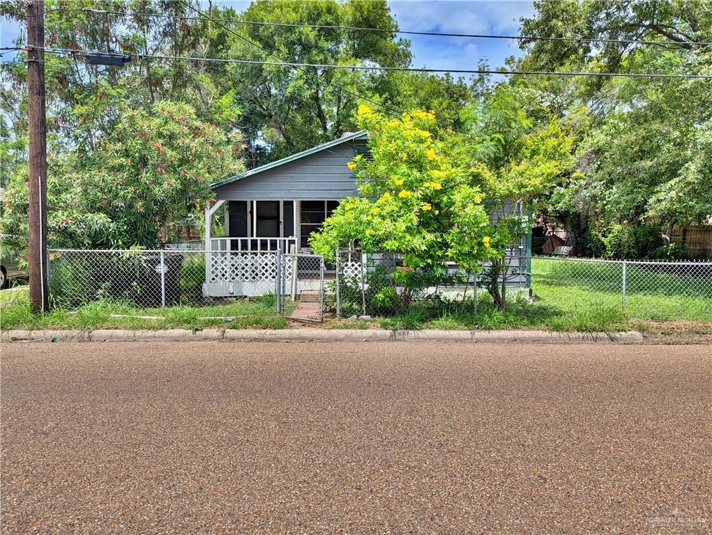 a front view of a house with a yard and a garage