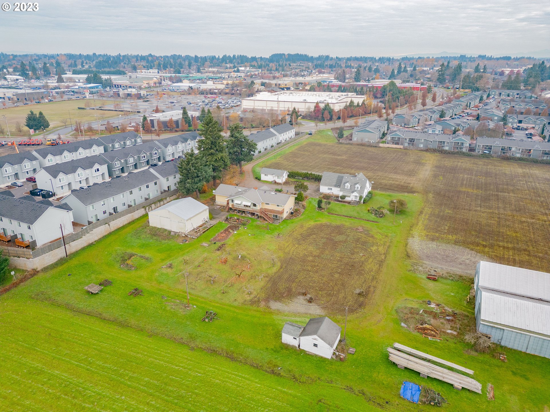 an aerial view of a residential houses with outdoor space