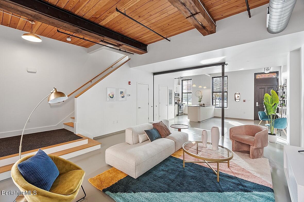 a living room with furniture and a rug