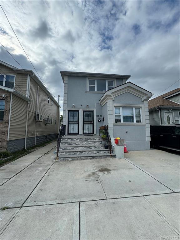 a view of house with garage