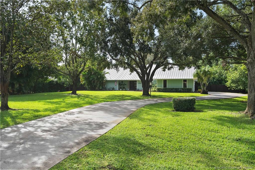 a view of a house with a big yard