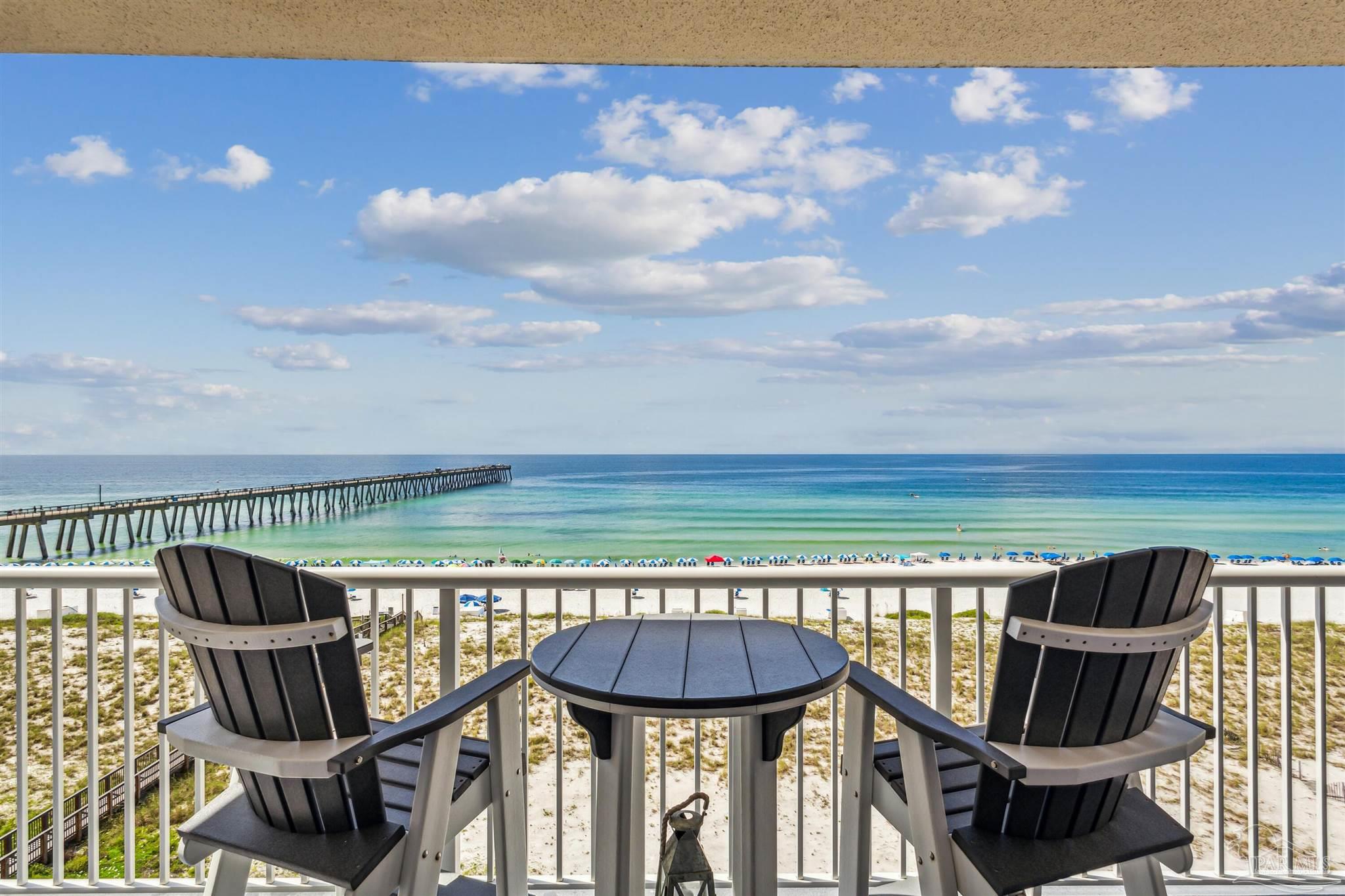 a terrace with outdoor seating and city view