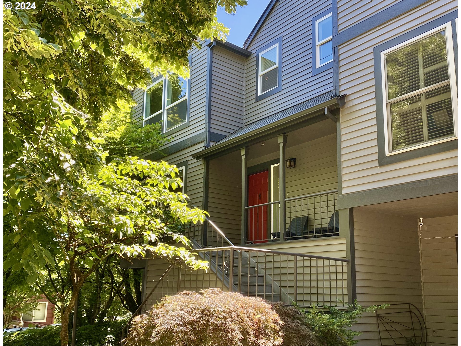 a view of a house with a tree