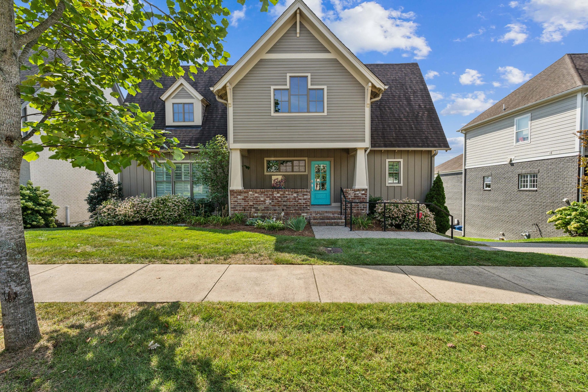 a front view of a house with garden