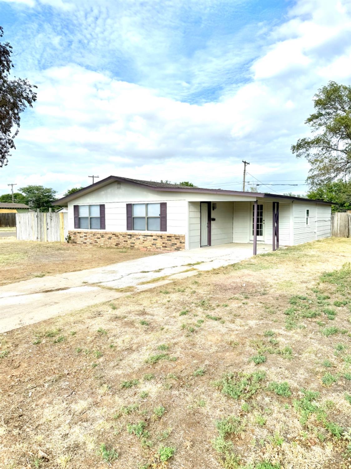 a front view of a house with the ocean