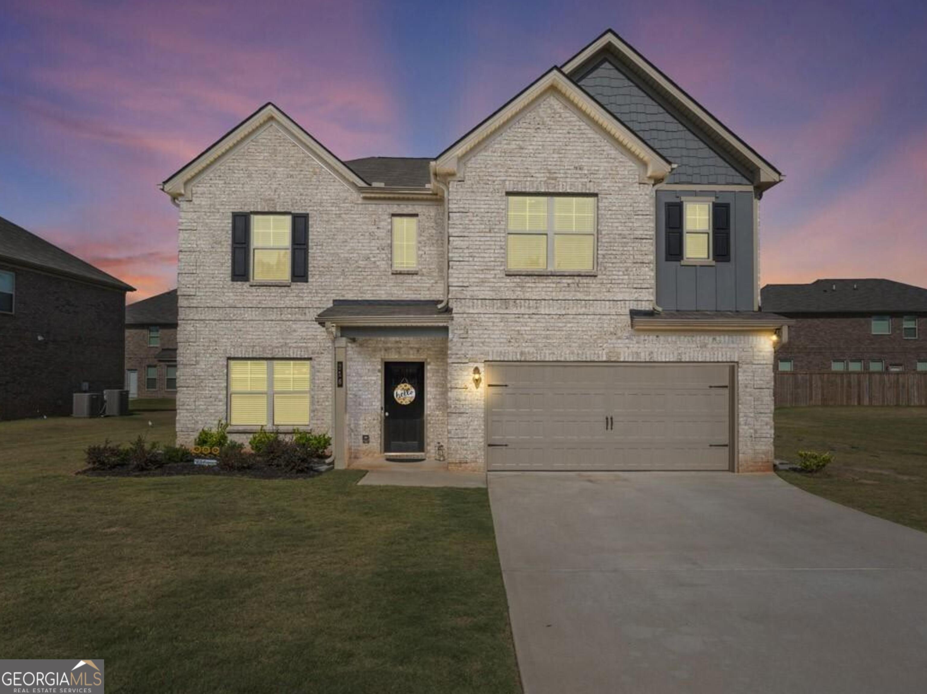 a front view of a house with a yard