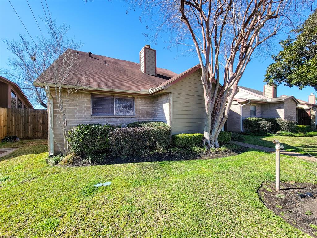 a house view with a garden space