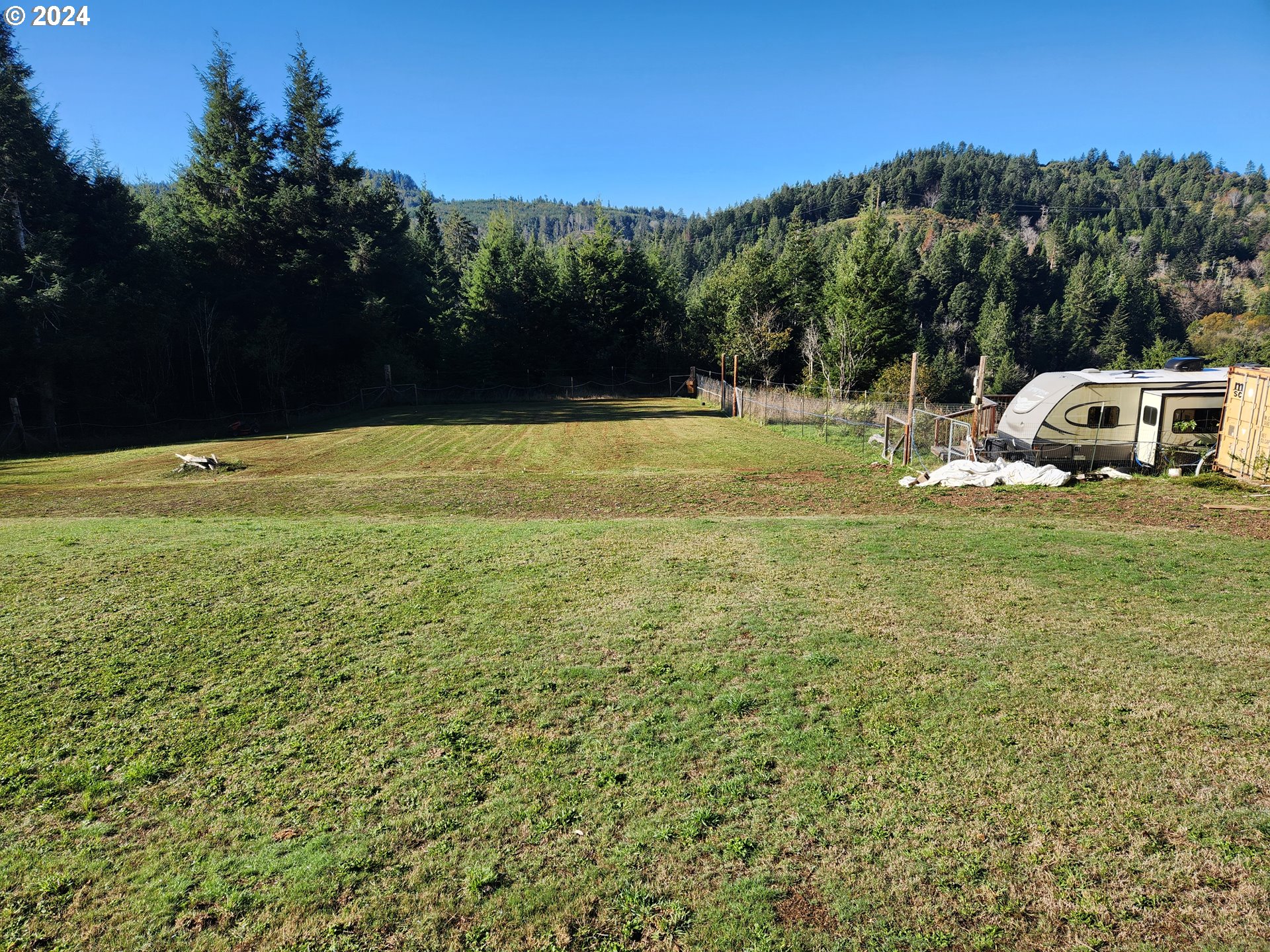 a view of a pool with a yard