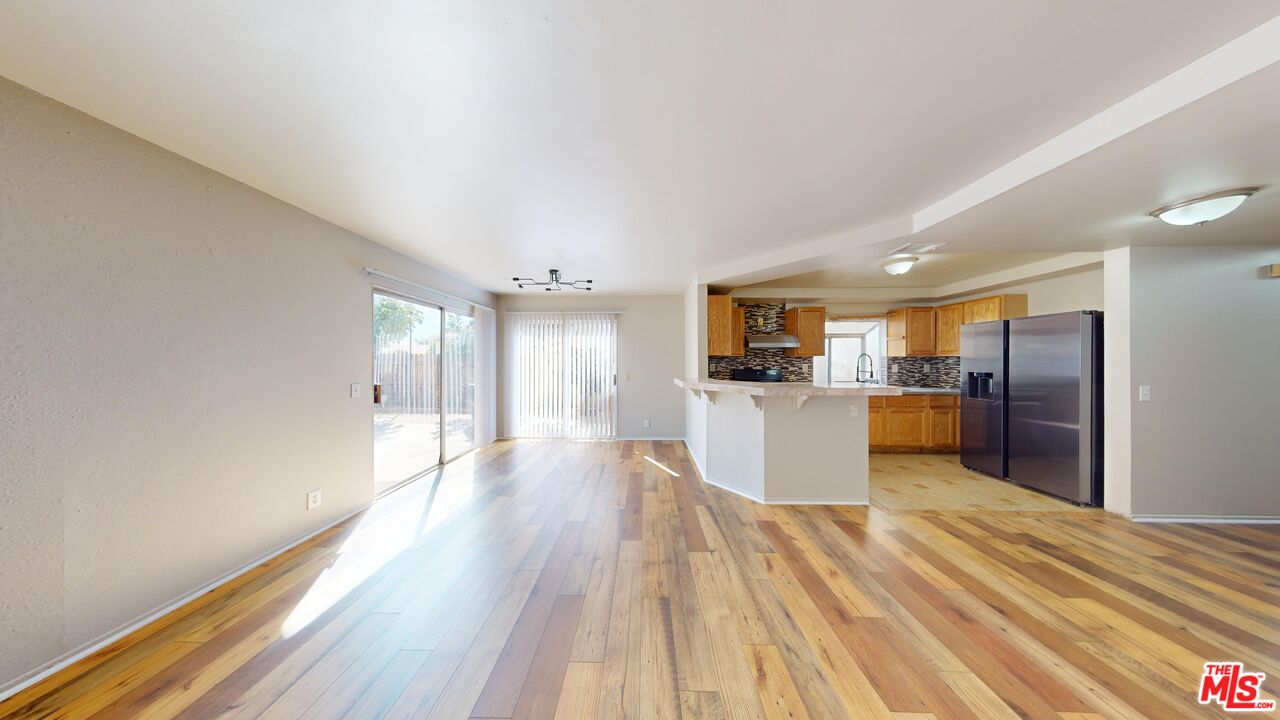 a view of kitchen with wooden floor