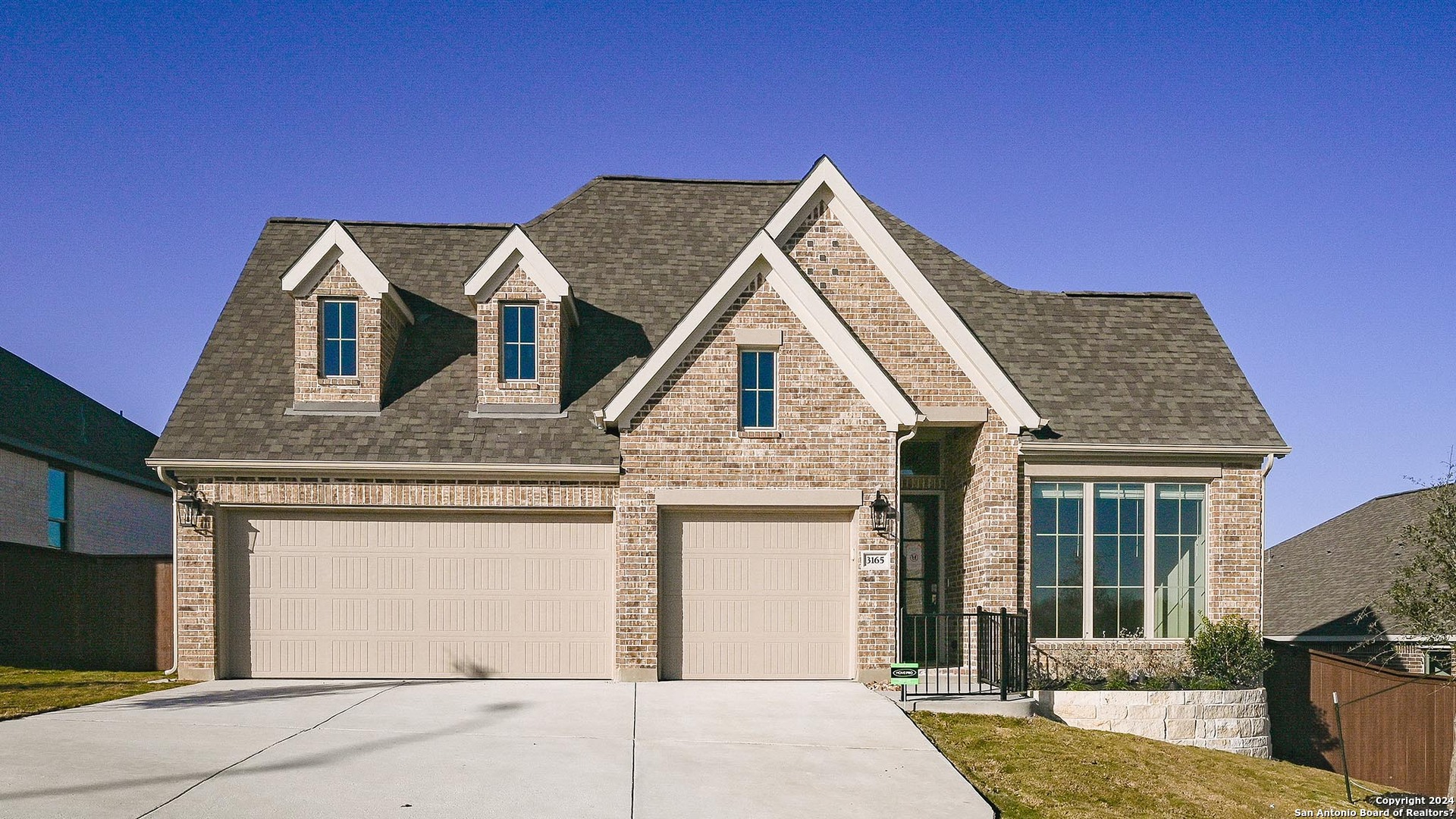 a front view of a house with a garage