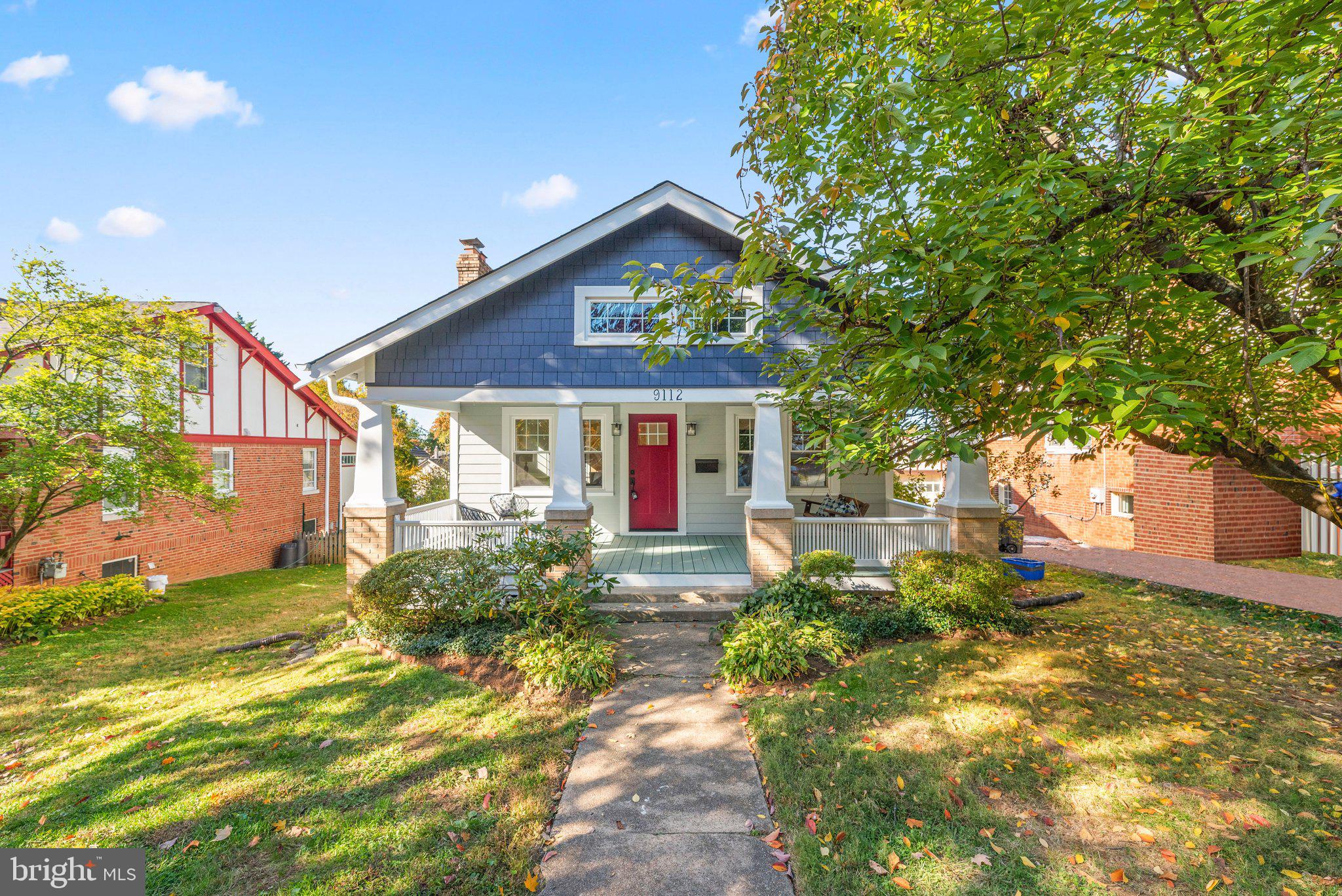 front view of a house with a yard