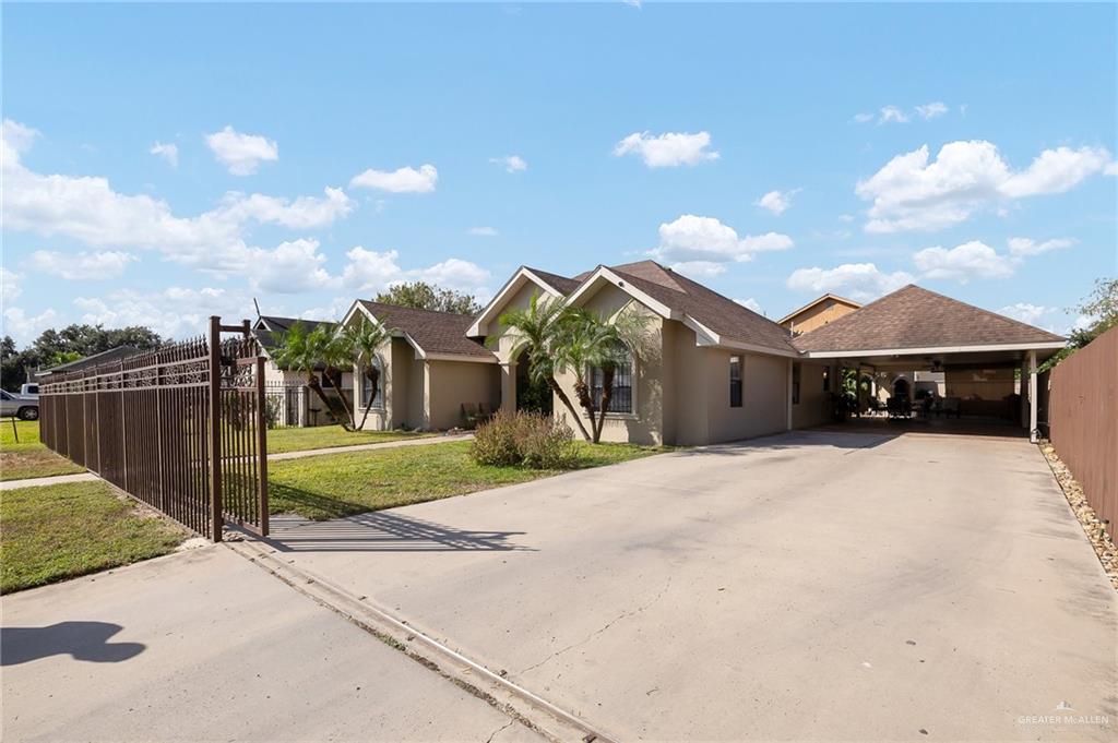 a view of a house with a yard