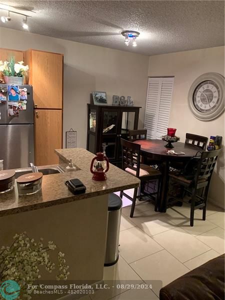 a kitchen with a sink and a stove top oven