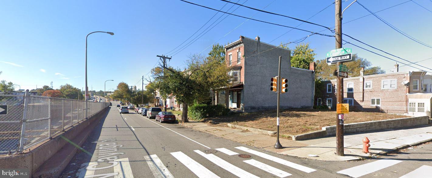 a view of a street with sitting area