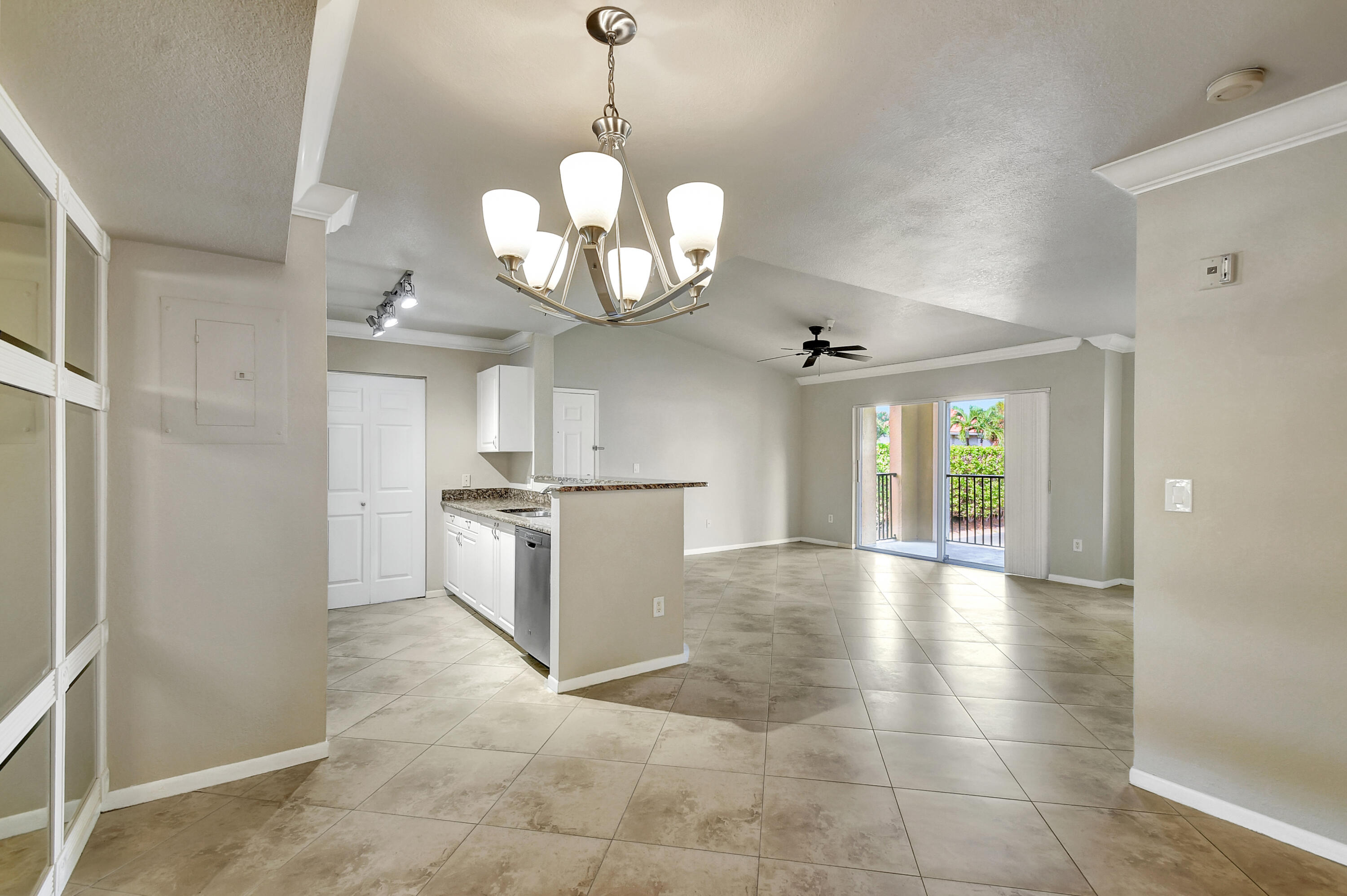 a view of a kitchen with a sink and dishwasher