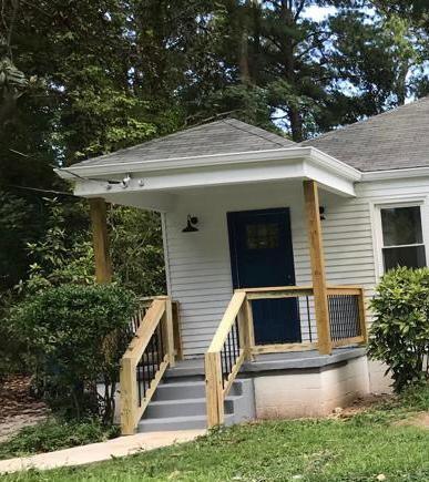 a view of house with yard