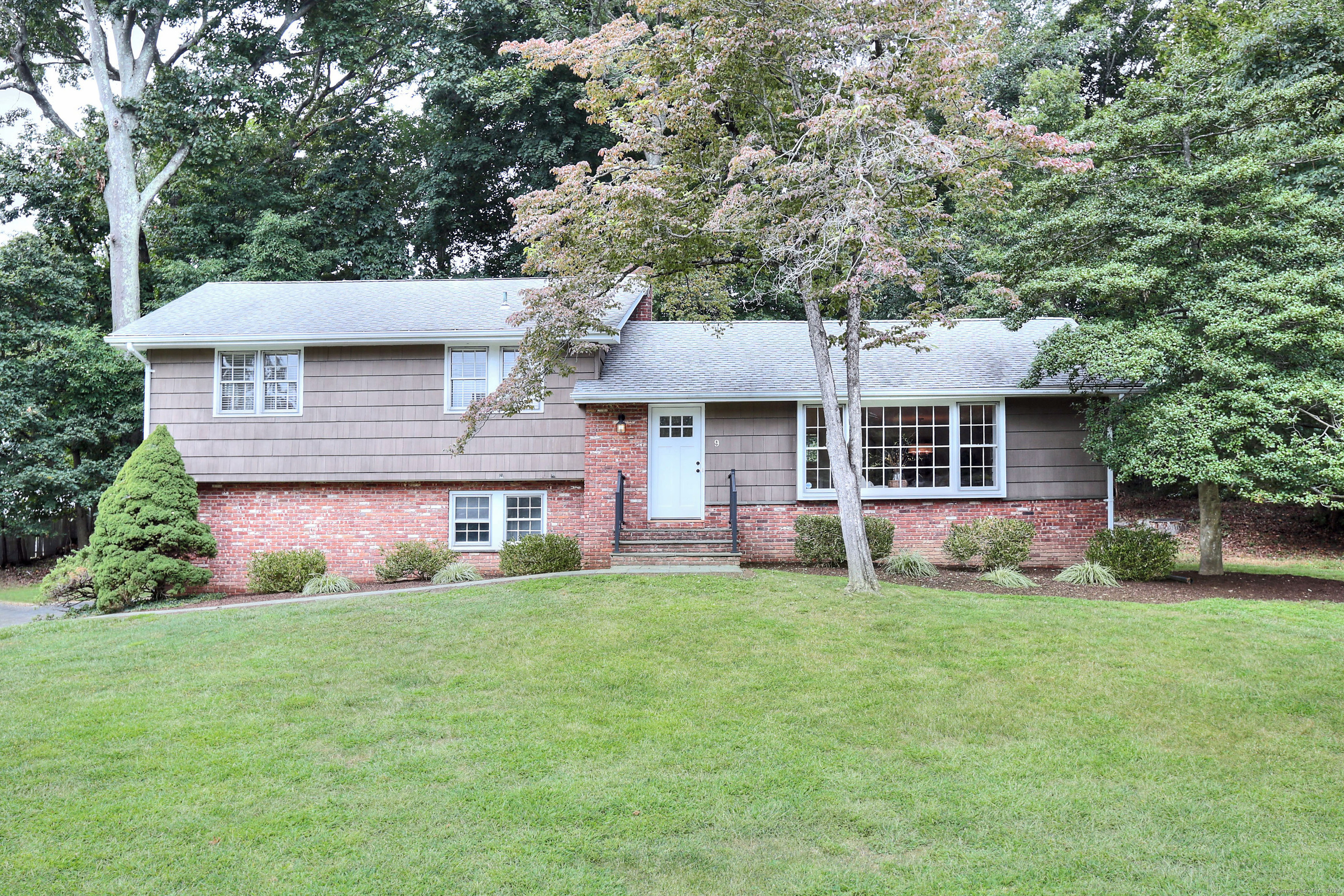 front view of a house with a yard