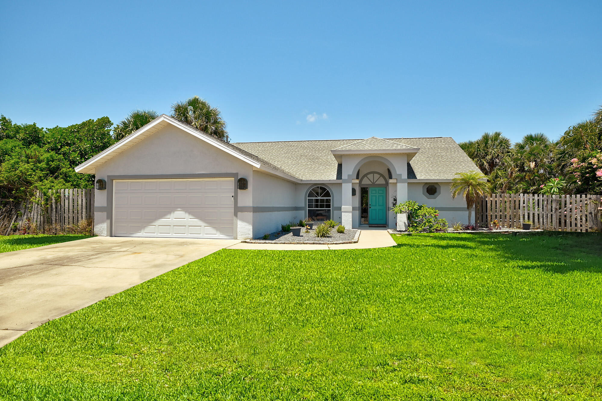 a front view of a house with swimming pool having outdoor seating