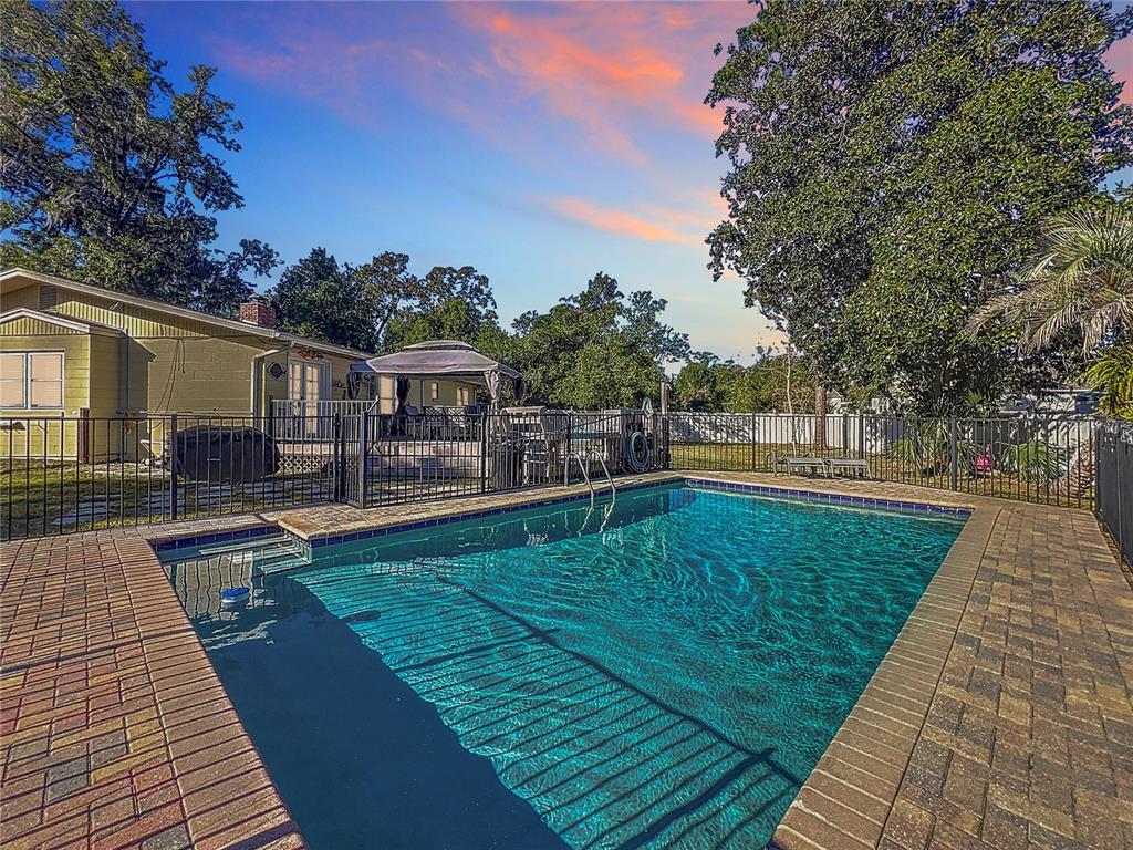 swimming pool view with seating space