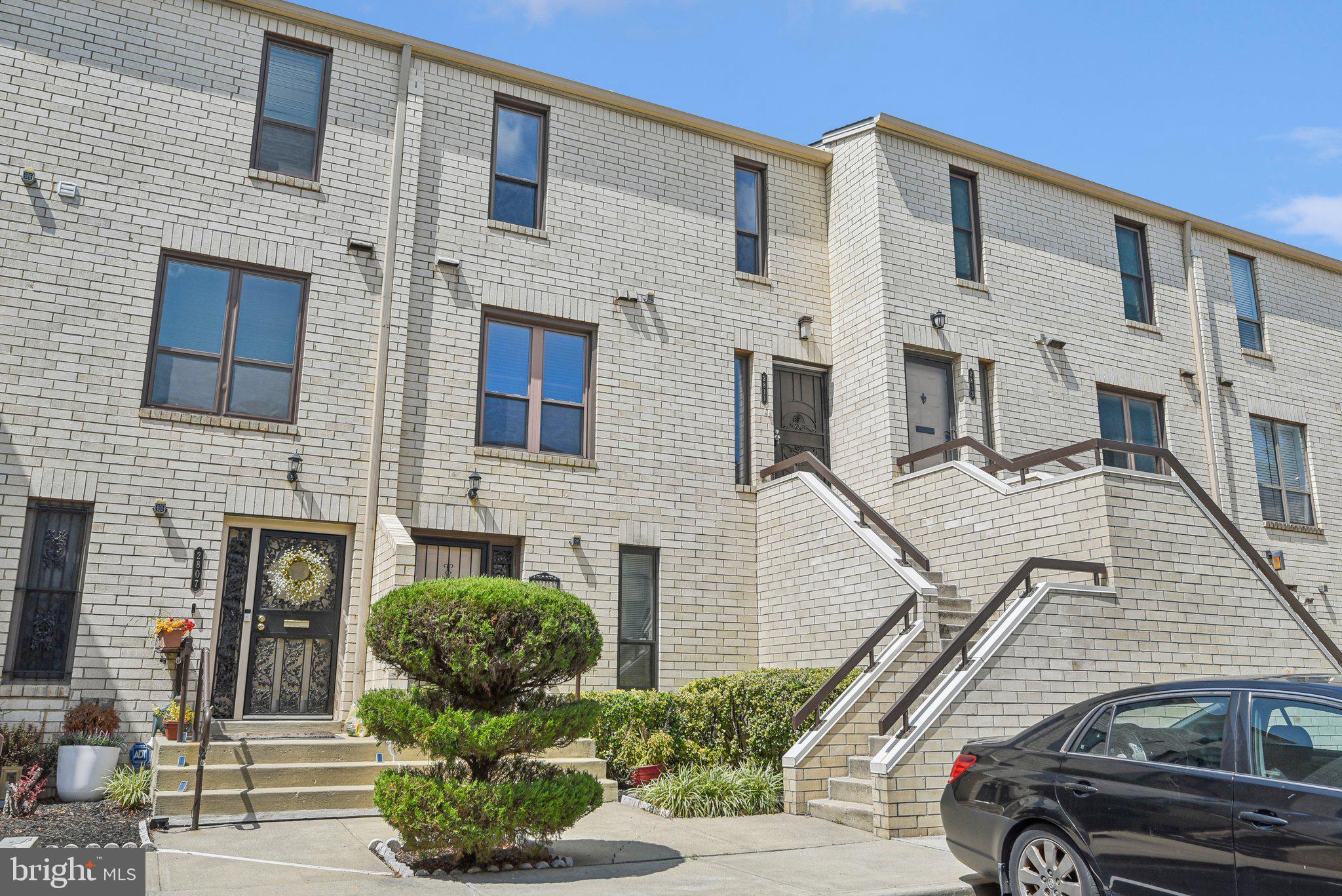 a front view of a house with parking space