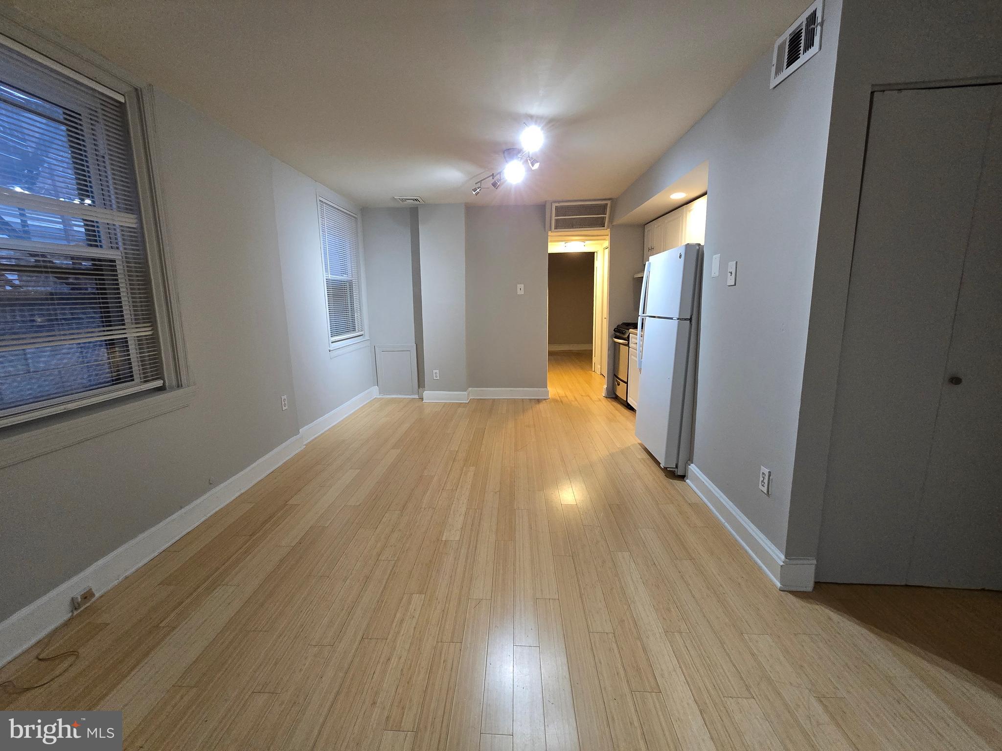 a view of livingroom with wooden floor