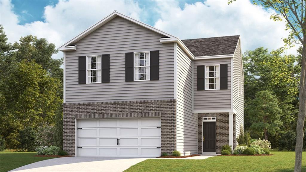 a front view of a house with a yard and garage