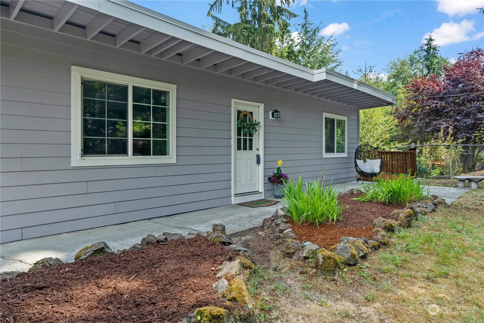 a front view of a house with garden