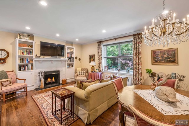 a living room with furniture fireplace and a flat screen tv