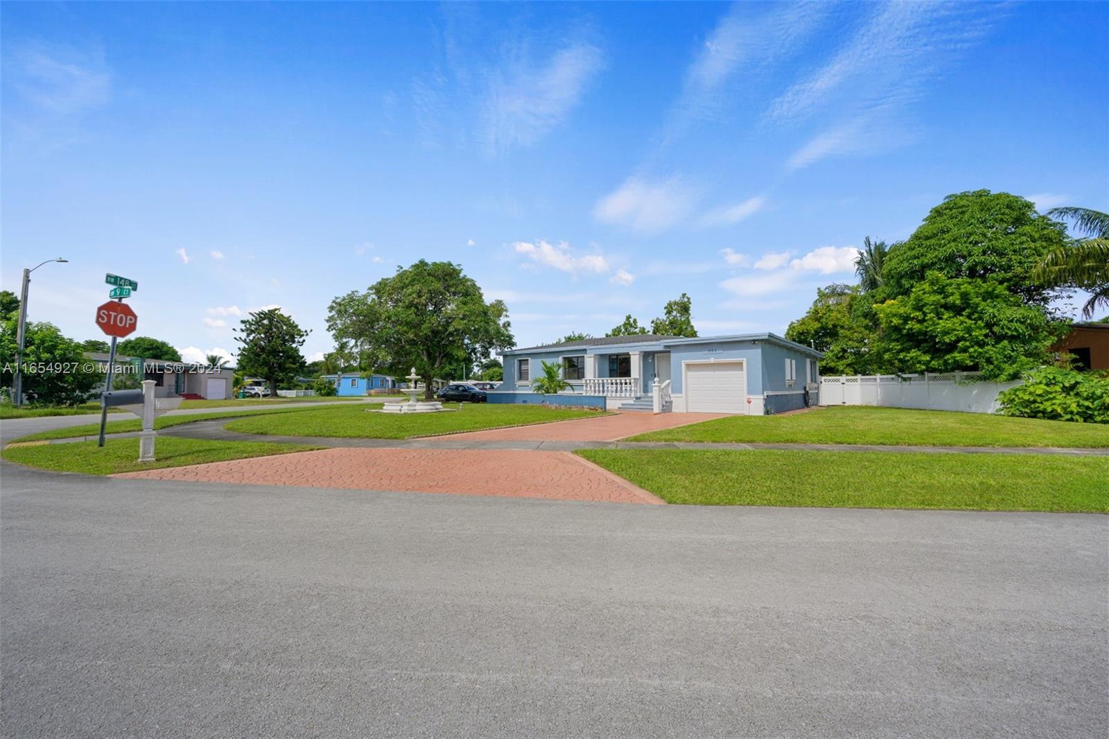 a view of a house with a swimming pool