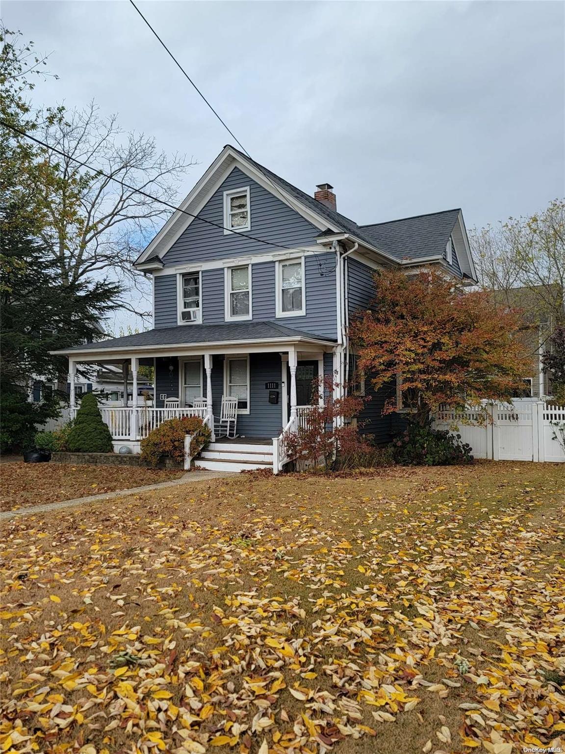 a view of a house with backyard sitting area and garden