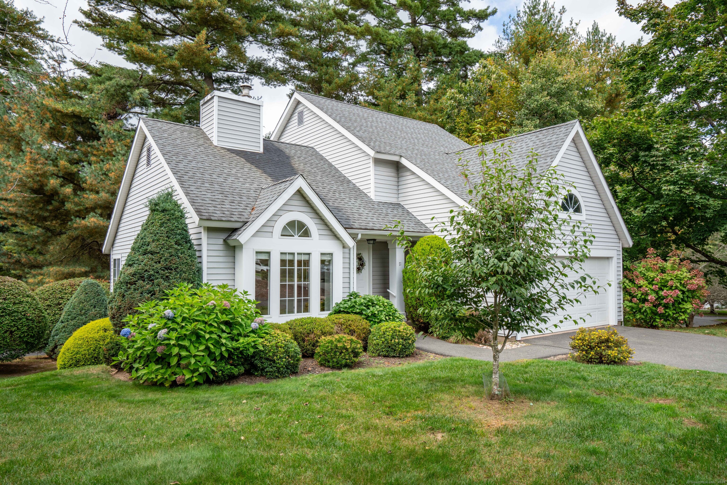 a aerial view of a house with a yard