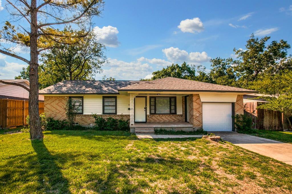 front view of a house with a yard