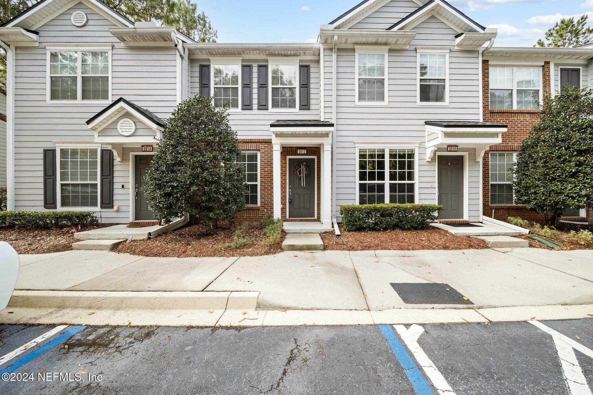 a front view of a house with yard