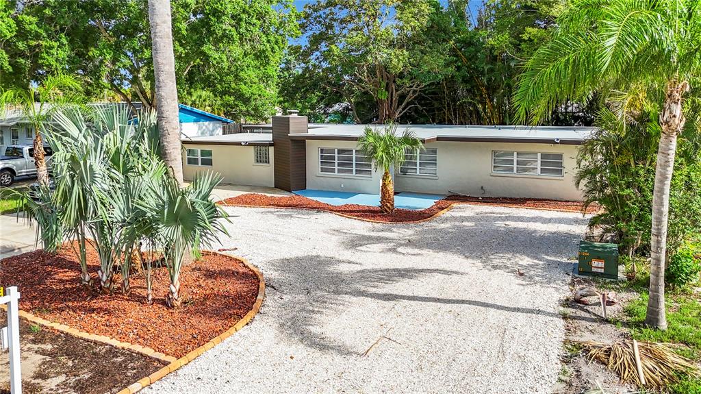 a view of a house with a tree